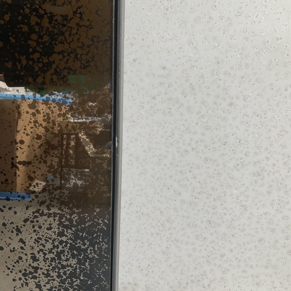 Aged floor mirror